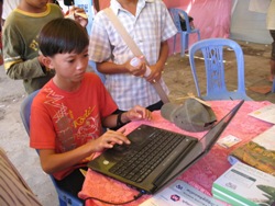 Little boy using a computer.