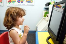 Little girl uses computer